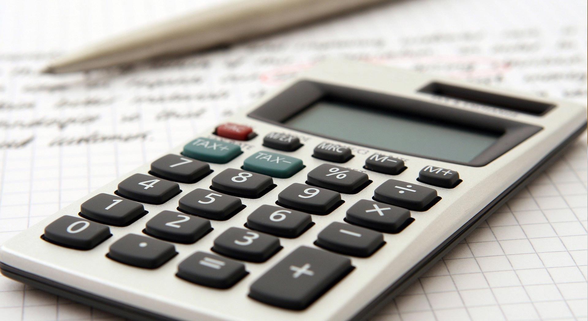 image showing calculator and handwriting