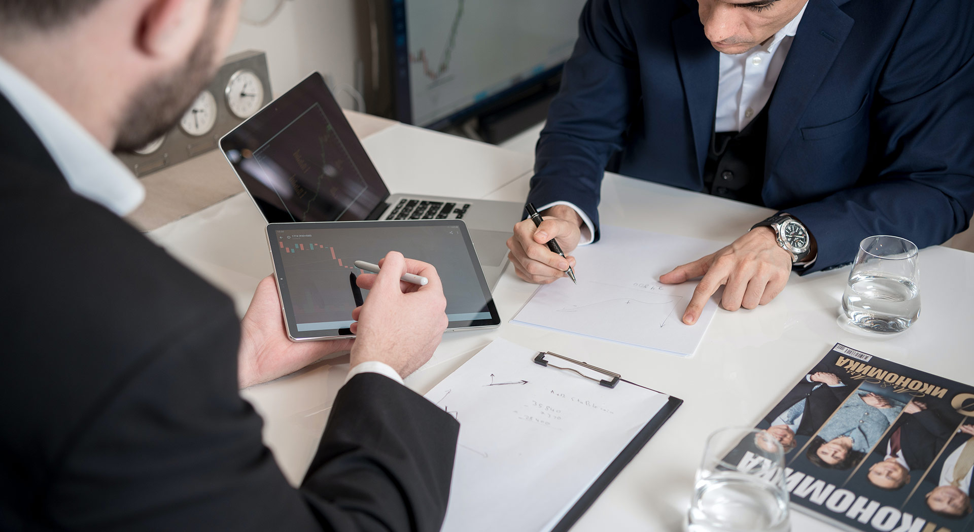 insurance affiliates talking and working over a desk