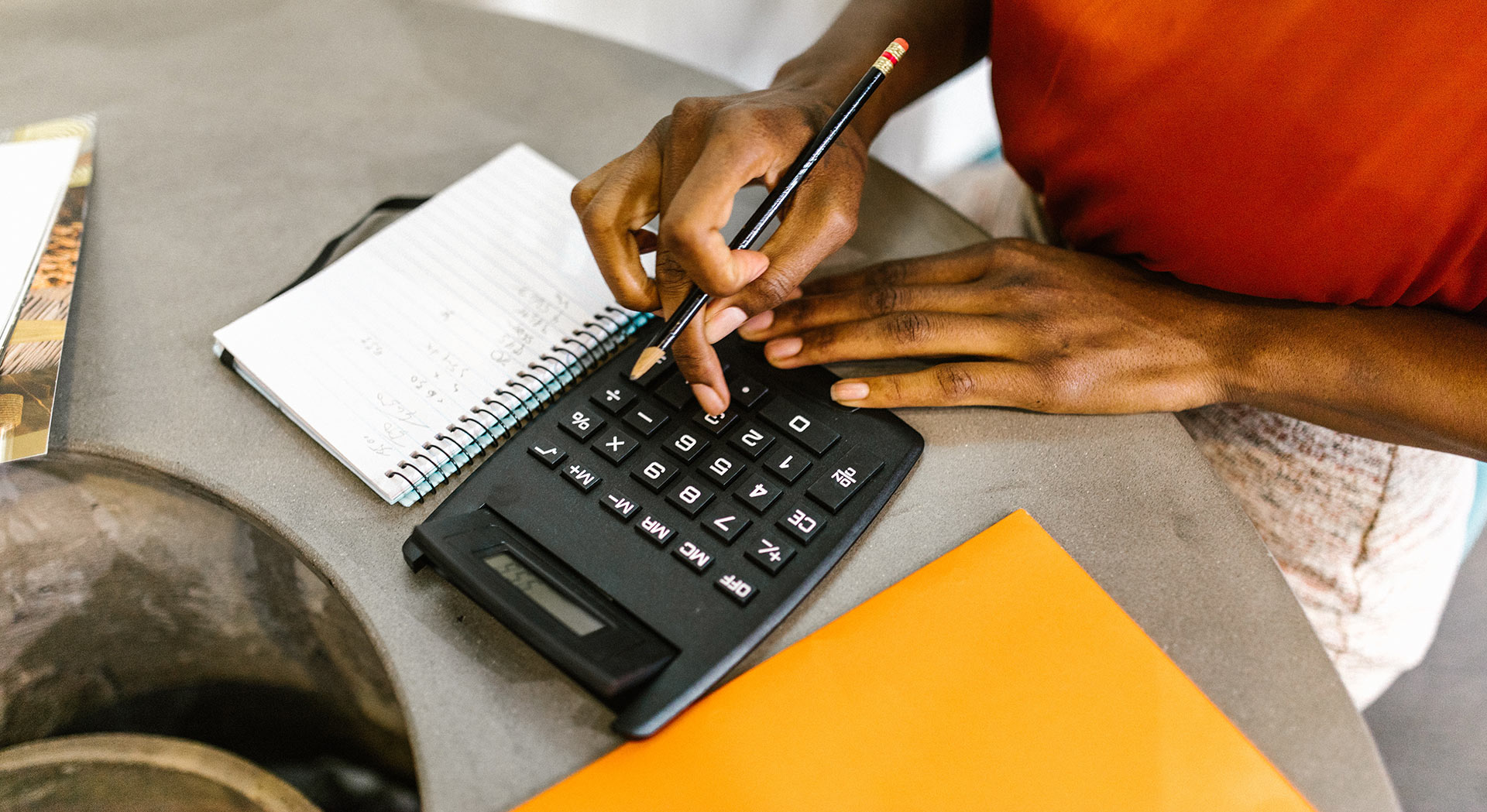 insurance broker working on a calculator